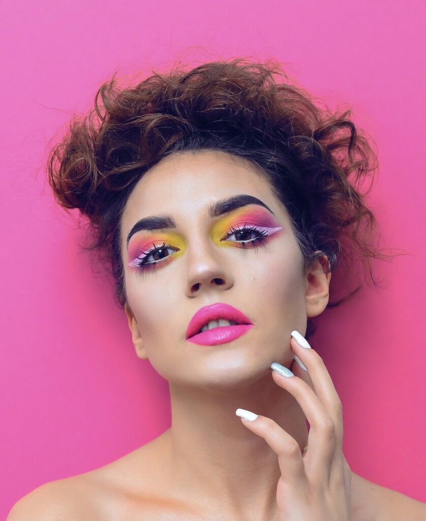 Confident Woman with Colorful Makeup.